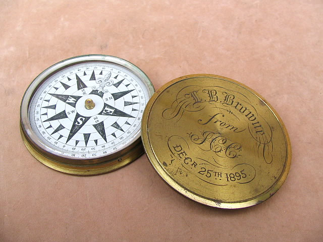 19th century explorers compass with push on lid dated 1895